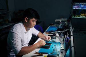 repairman trying to fix smatphone 2025 01 29 12 20 15 utc